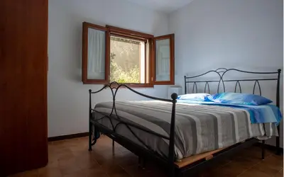 Letto o letti in una camera di Un Giardino sul Mare