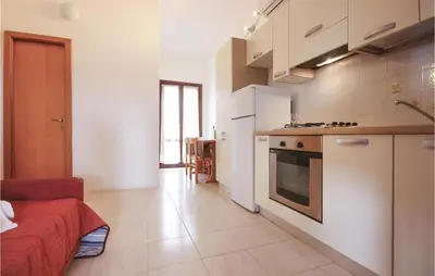 Cucina o angolo cottura di Cozy Apartment In Costa Rei -Ca-