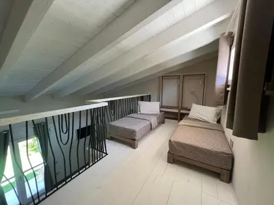 Letto o letti in una camera di ALELCA DOMO