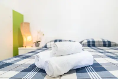 Letto o letti in una camera di Casa Matilda Villasimius, 7 posti, 3 stanze, doppio giardino