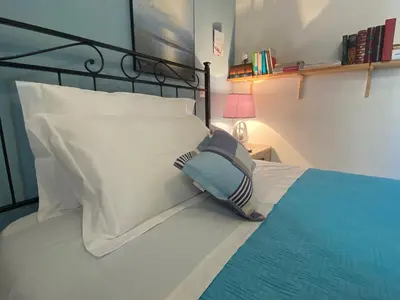 Letto o letti in una camera di Iola Rooms - Q9416