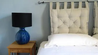 Letto o letti in una camera di Iola Rooms - Q9416
