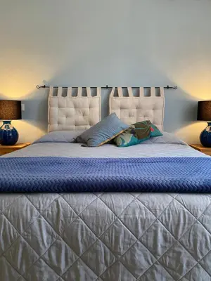 Letto o letti in una camera di Iola Rooms - Q9416