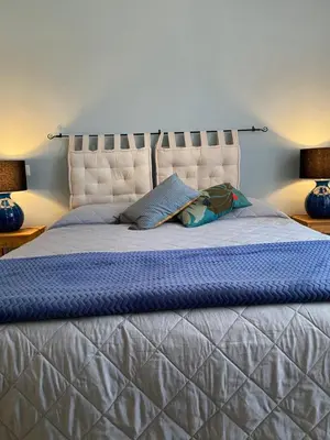 Letto o letti in una camera di Iola Rooms - Q9416