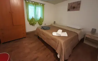 Letto o letti in una camera di Garden House Q4527
