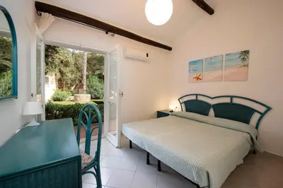 Letto o letti in una camera di Villa Adelaide