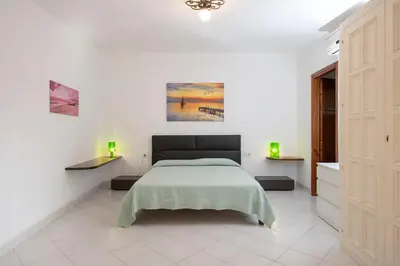 Letto o letti in una camera di Villa Adelaide