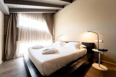 Letto o letti in una camera di Neko Boutique Hotel