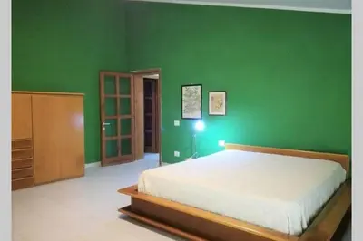 Letto o letti in una camera di Big relax apartment with swimming pool and a peaceful garden in a private villa