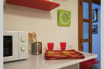 Cucina o angolo cottura di Big relax apartment with swimming pool and a peaceful garden in a private villa