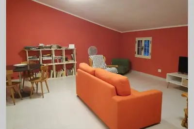 Area soggiorno di Big relax apartment with swimming pool and a peaceful garden in a private villa