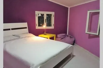 Letto o letti in una camera di Big relax apartment with swimming pool and a peaceful garden in a private villa