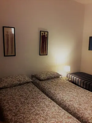 Letto o letti in una camera di Appartamento presso il Teatro Lirico