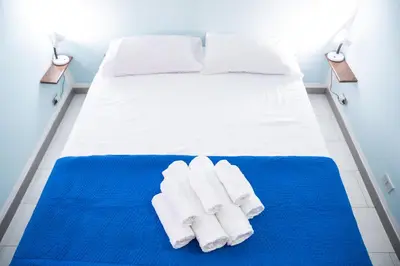 Letto o letti in una camera di Casa Josto a due passi da Spiaggia Maladroxia