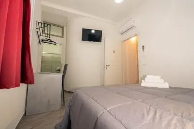 Letto o letti in una camera di DOMOBLU Camere In Centro
