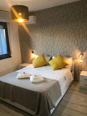 Letto o letti in una camera di Nuovo appartamento Elegante,curato nei dettagli