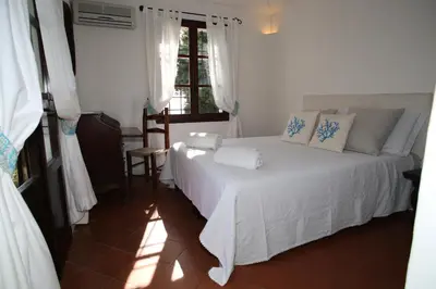 Letto o letti in una camera di Villa con discesa privata a mare