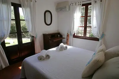 Letto o letti in una camera di Villa con discesa privata a mare
