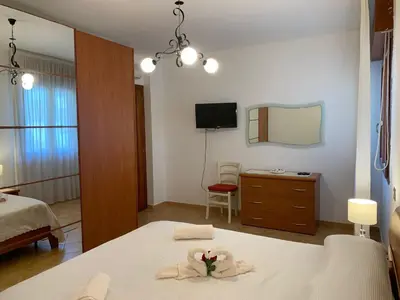 Letto o letti in una camera di Casa Elisa