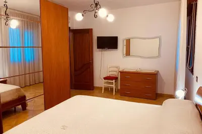 Letto o letti in una camera di Casa Elisa