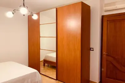 Letto o letti in una camera di Casa Elisa
