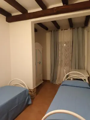 Letto o letti in una camera di Angolo relax a due passi dal mare
