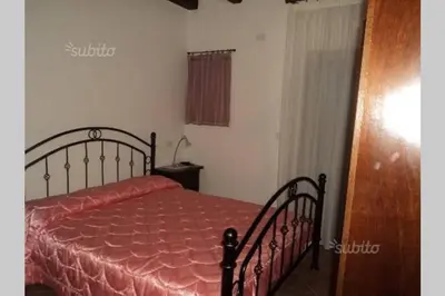 Letto o letti in una camera di Angolo relax a due passi dal mare