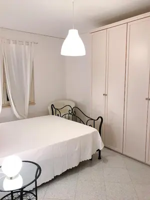 Letto o letti in una camera di Piana Apartment