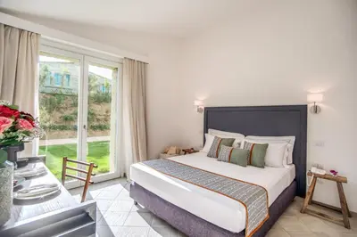 Letto o letti in una camera di Cala Sinzias Resort