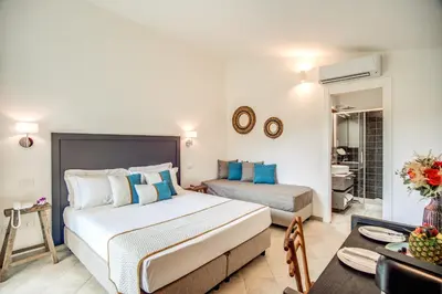 Letto o letti in una camera di Cala Sinzias Resort