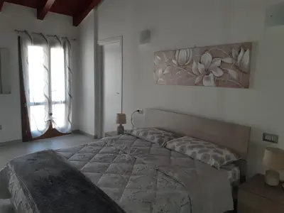 Letto o letti in una camera di B&B La Genuina