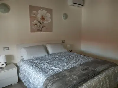 Letto o letti in una camera di B&B La Genuina