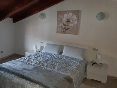 Letto o letti in una camera di B&B La Genuina
