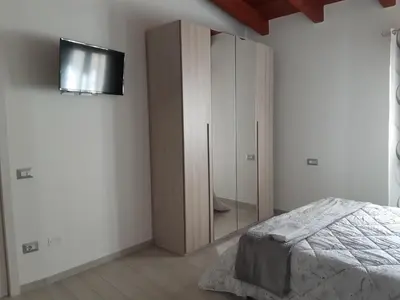 Letto o letti in una camera di B&B La Genuina