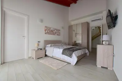 Letto o letti in una camera di B&B La Genuina