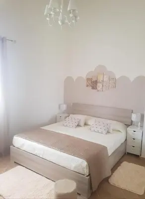 Letto o letti in una camera di La Casa Delle Rose 2