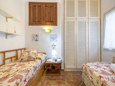 Letto o letti in una camera di Casa Flamingo 150m dal mare