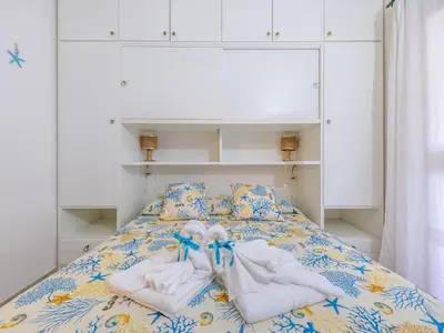 Letto o letti in una camera di Casa Flamingo 150m dal mare