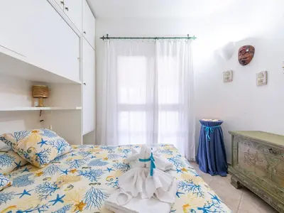 Letto o letti in una camera di Casa Flamingo 150m dal mare