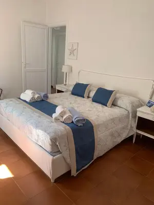 Letto o letti in una camera di Casa Babila 2 minutes from the beautiful beach