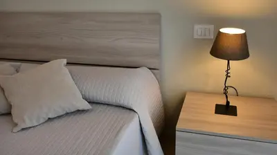 Letto o letti in una camera di Affittacamere La Suite dei Graniti