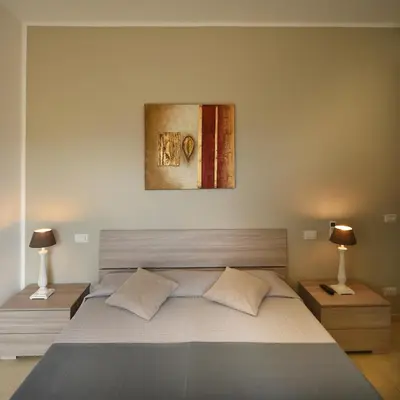 Letto o letti in una camera di Affittacamere La Suite dei Graniti