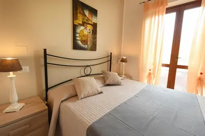 Letto o letti in una camera di Affittacamere La Suite dei Graniti