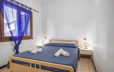 Letto o letti in una camera di 1 Bedroom Stunning Apartment In Costa Rei -Ca-