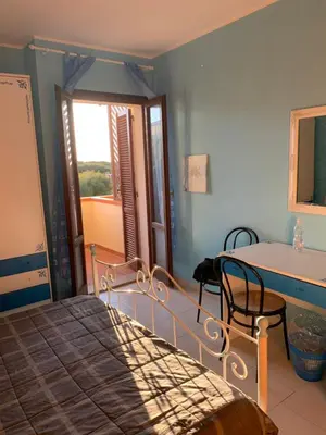 Letto o letti in una camera di Casa accogliente