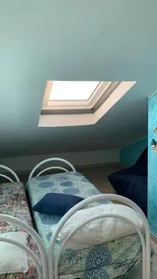 Letto o letti in una camera di Casa accogliente