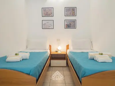 Letto o letti in una camera di Casa Mazzini - Morada