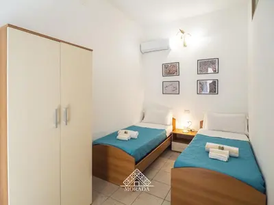 Letto o letti in una camera di Casa Mazzini - Morada