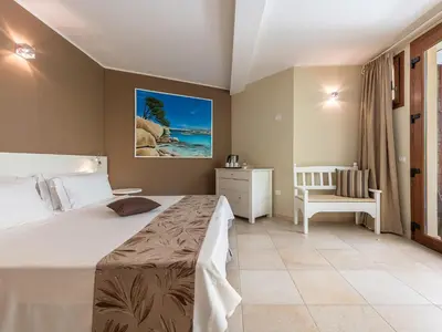 Letto o letti in una camera di B&B Giglio di Chia