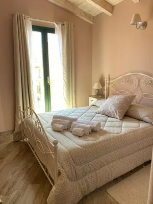 Letto o letti in una camera di La Soffitta di EmmaSofia